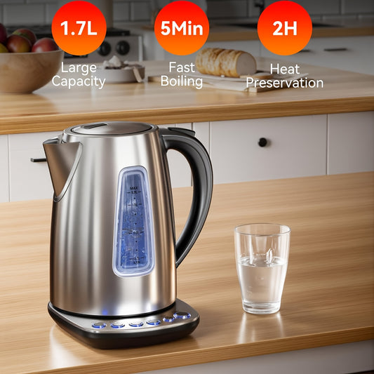 Stainless steel electric kettle on a kitchen counter with a glass of water next to it.