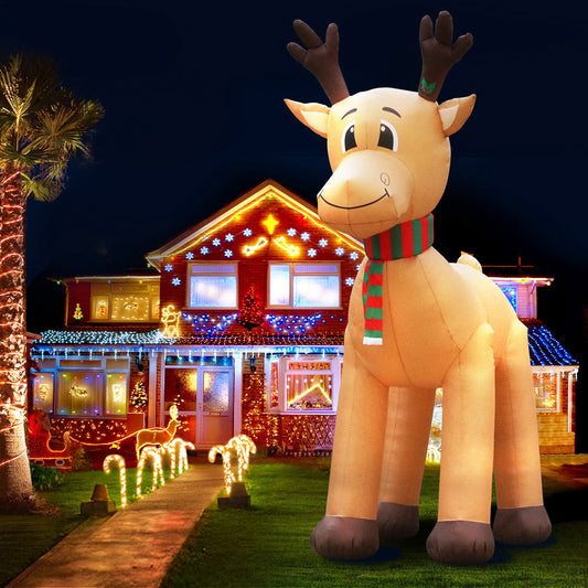 Inflatable reindeer decoration in front of a house with Christmas lights