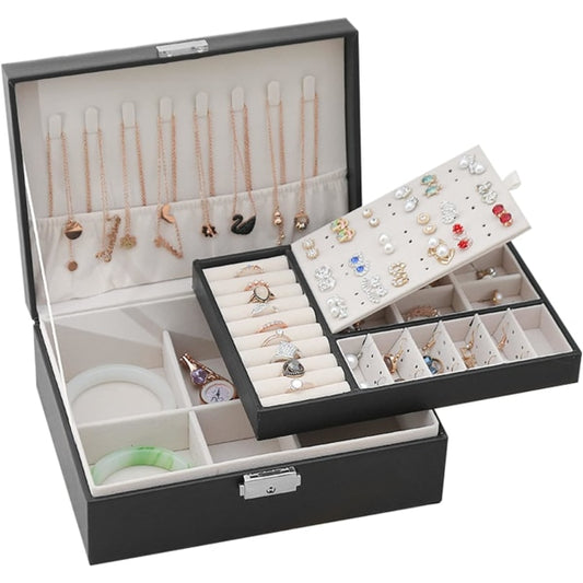 Jewelry organizer with necklaces, rings, and earrings on a white background