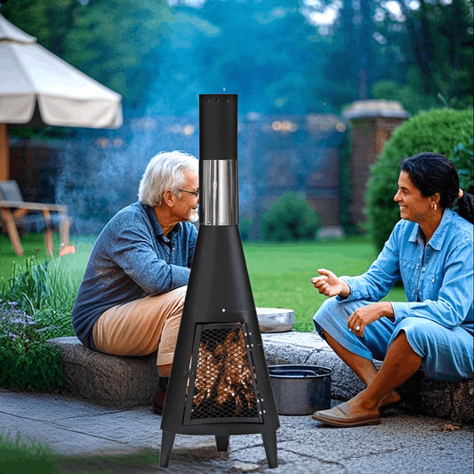 Two people sitting outdoors by a modern outdoor fireplace on a patio.