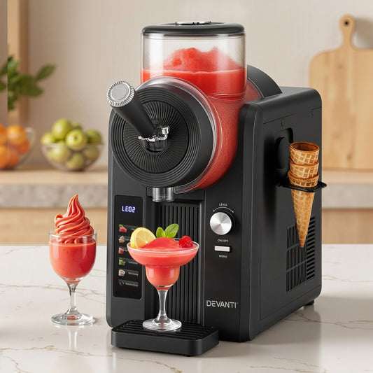 Black frozen yogurt or ice cream machine with red slushy, cones, and glasses on a kitchen counter.