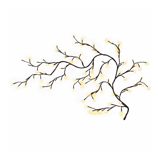 Flexible willow vine lights shaped on a wall