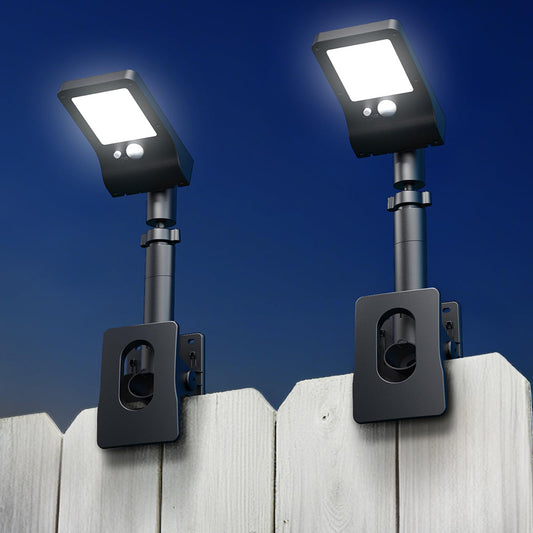 Clip-on solar motion light with 60 LEDs on a fence