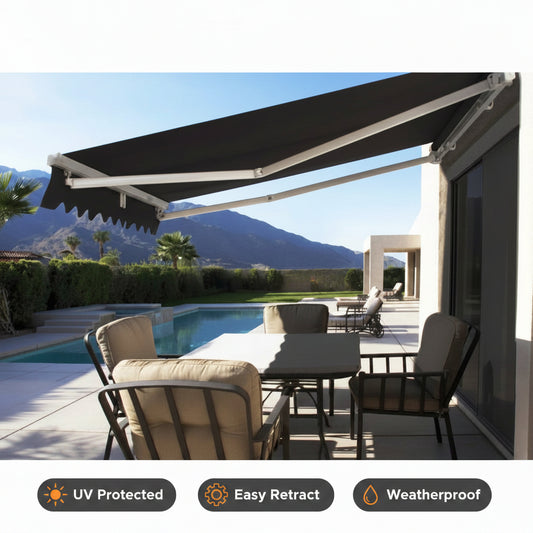 Grey retractable folding arm awning extended over a patio