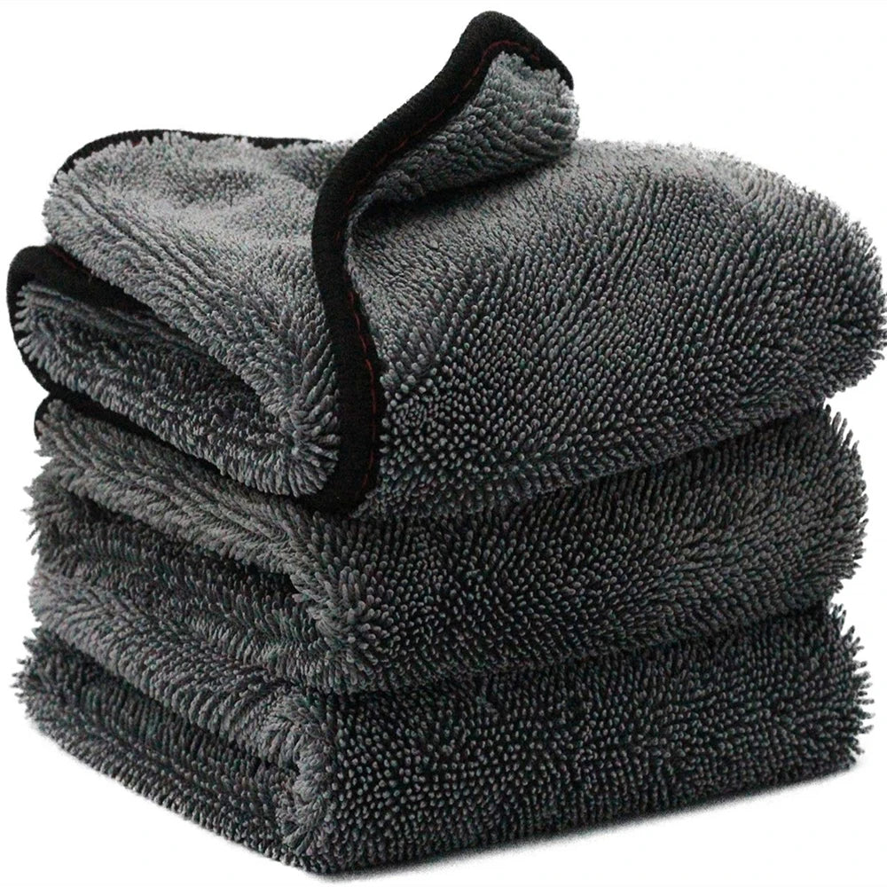 Stack of gray microfiber towels on a white background