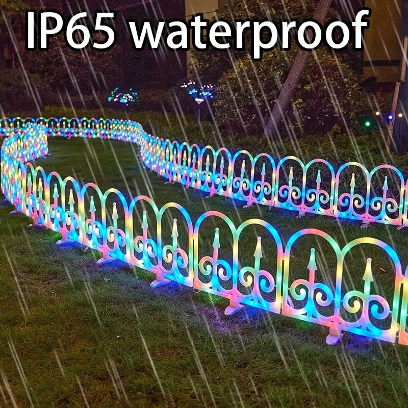 Solar fence lights lighting a garden path at night