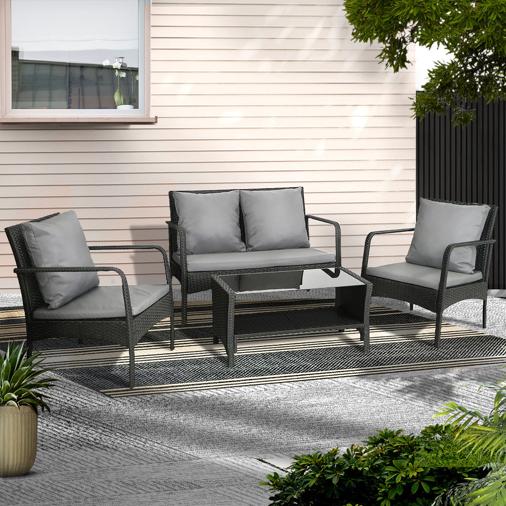 4-piece black wicker outdoor sofa set with glass table