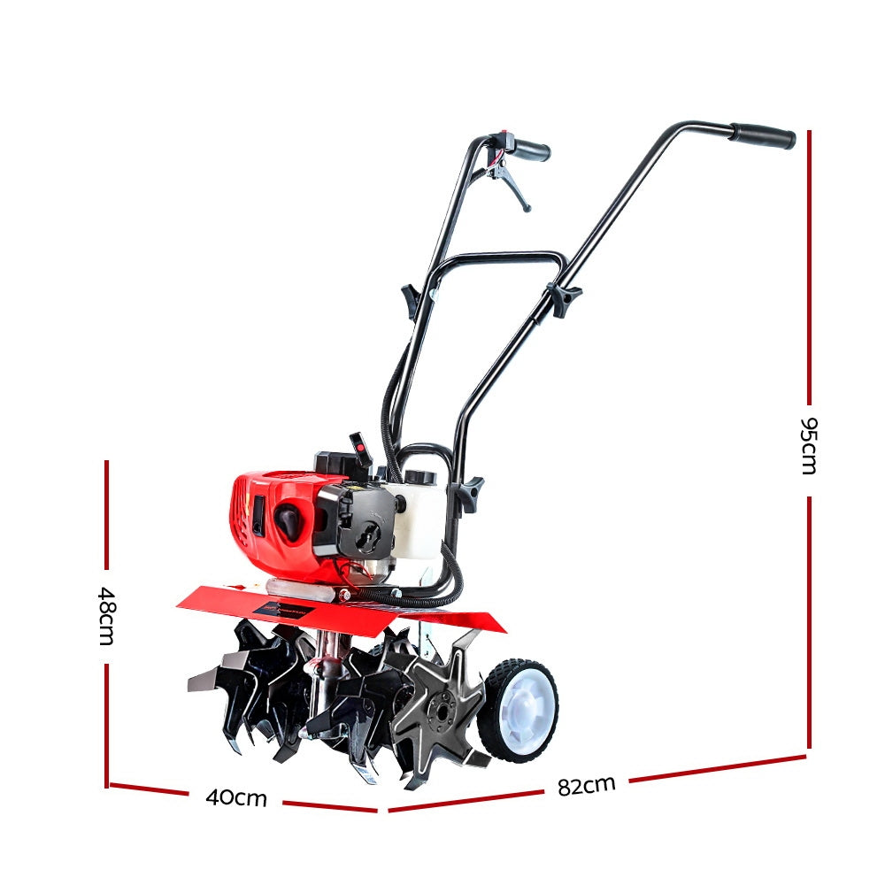 Petrol tiller breaking up garden soil