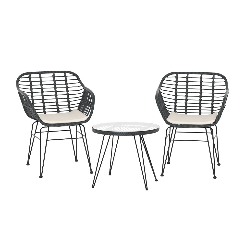 Outdoor wicker chair with water-resistant cushion