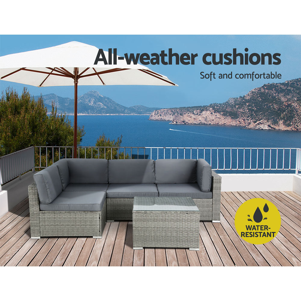 Modular wicker sofa set arranged on a patio