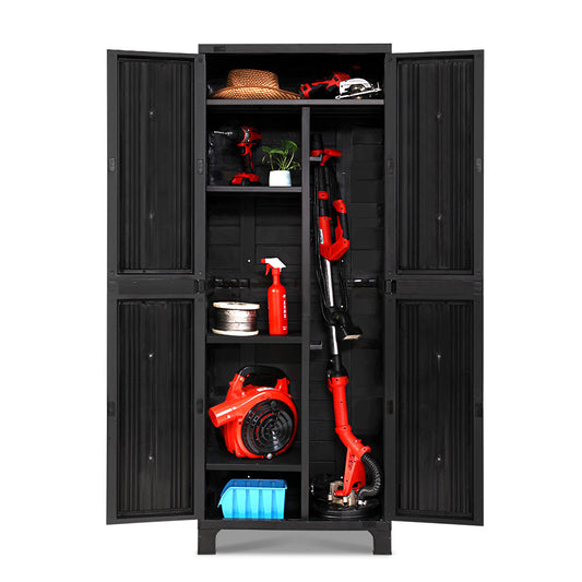 A black outdoor storage cabinet with lockable doors, containing various gardening tools and equipment, including a lawn mower, a hose, and storage boxes.