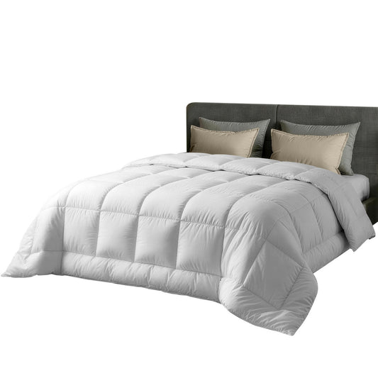 Wool quilt shown on a double bed in a cosy bedroom