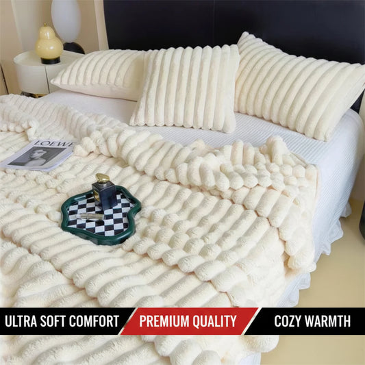 White textured blanket on a bed with pillows and a chess set.