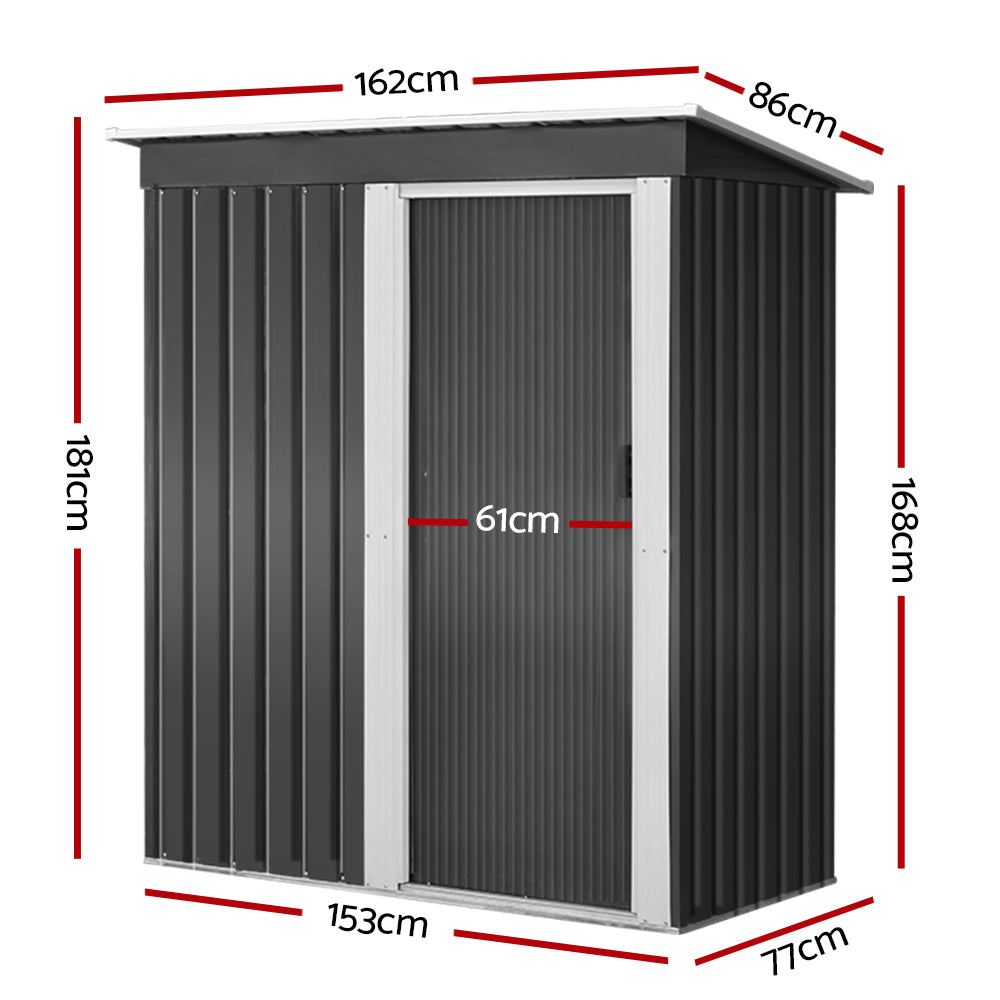 Metal garden shed in a backyard for outdoor tool storage