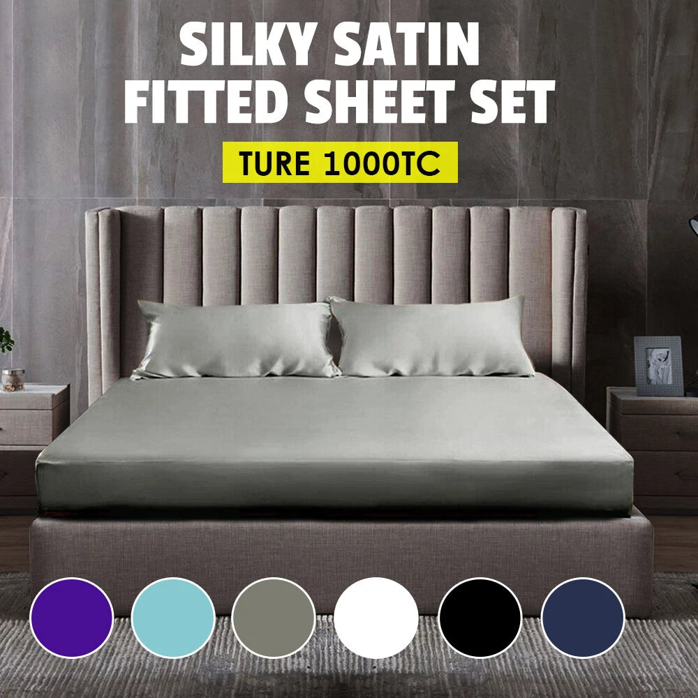 Gray satin fitted sheet set on a bed with color swatches below.