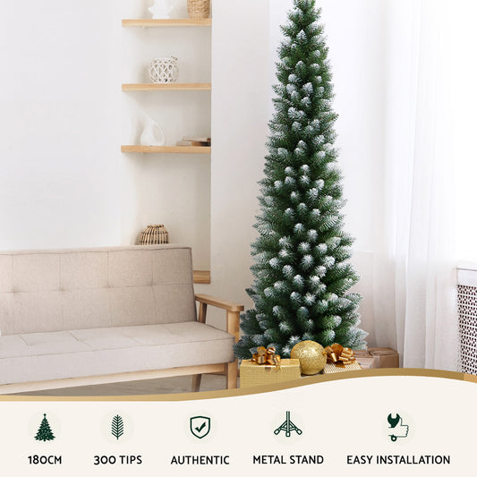 Snow flocked Christmas tree in a living room