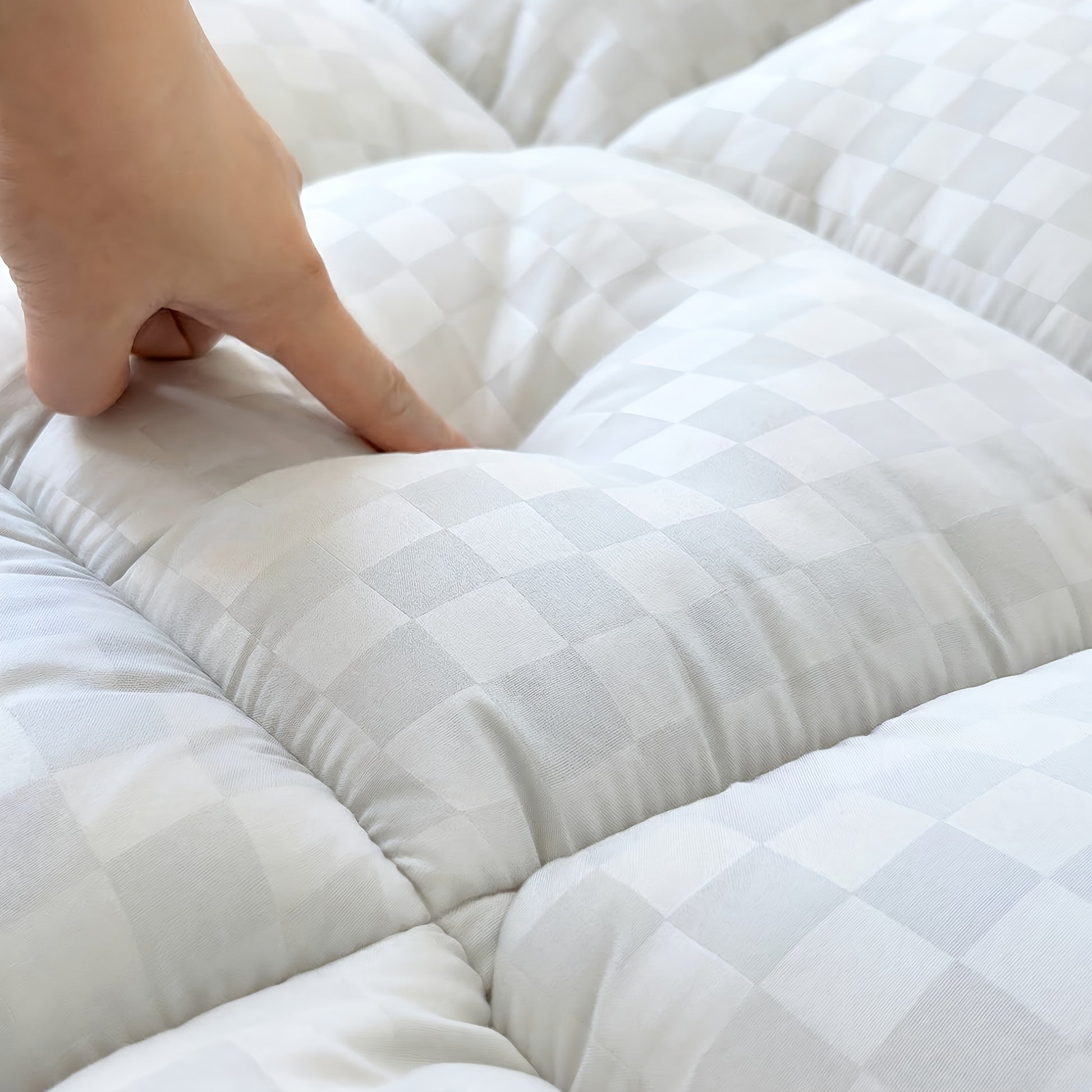 Deep-pocket no-slip skirt stretching over the mattress