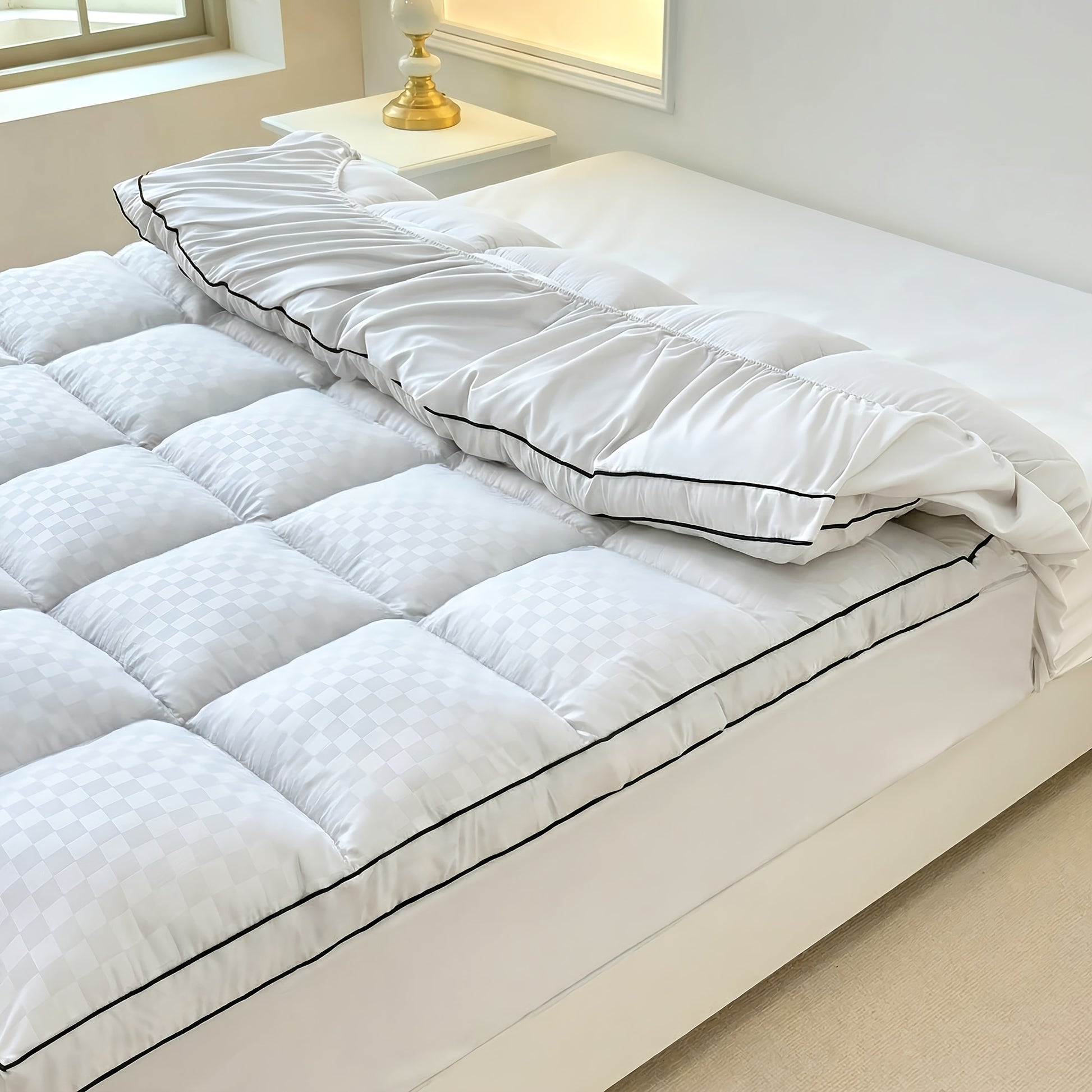 Mattress protector available in white, grey and black