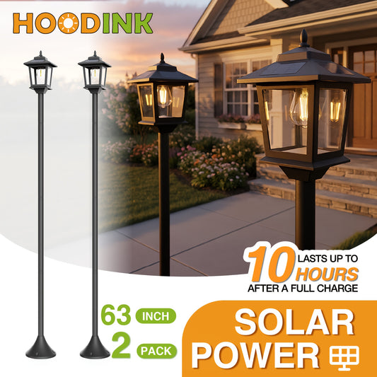 Black solar pathway light along a garden path