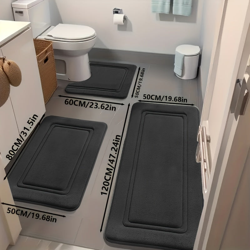 Super absorbent plush bath mats by a shower